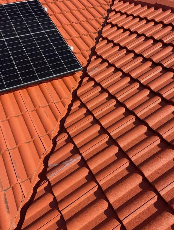 Broken roof tiles requiring repair